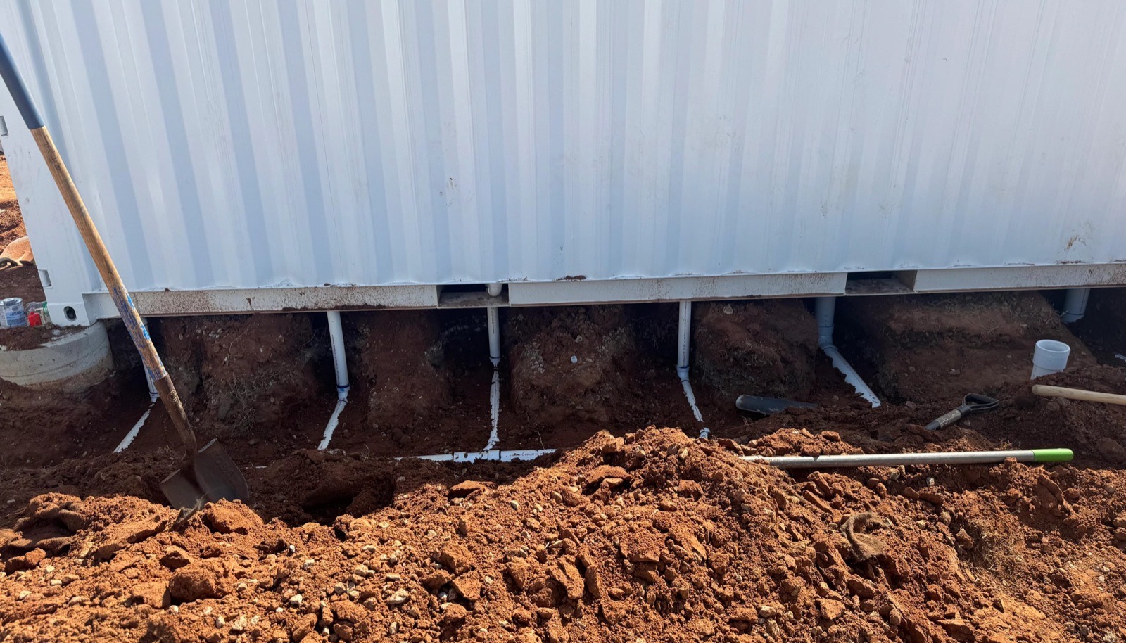 Okie Plumbing running a new rough-in on a job site